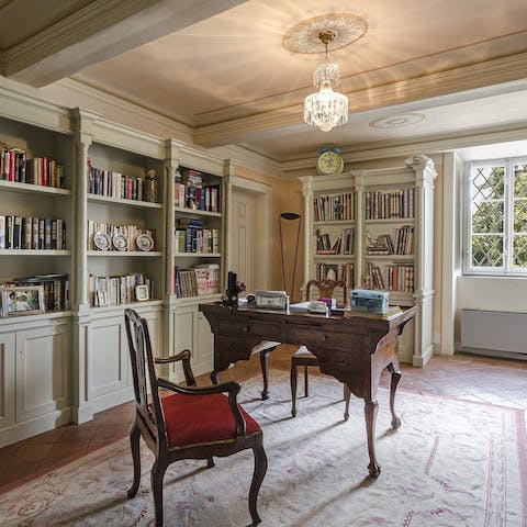 Work remotely in style in the book-lined office