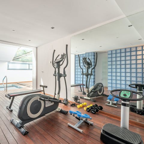 Stay on top of your fitness routine with a workout in the private gym