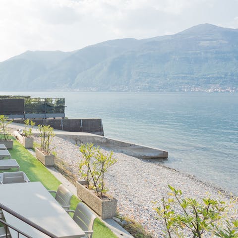 Watch boats bob on the water from the shingle of your private beach