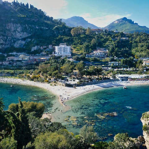 Discover Mazzarò sandy beaches, just a twenty-minute walk from your villa
