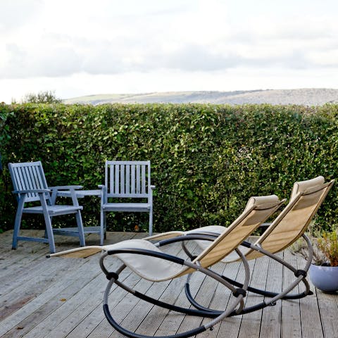 Put your feet up and relax on the deck, admiring the views over the hills