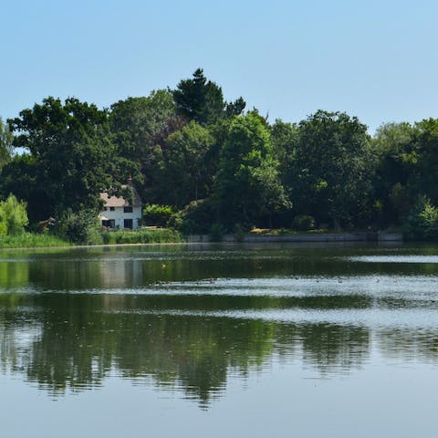 Gaze out over the stunning private lake outside your door