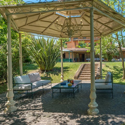 Take your evening aperitivo beneath the candelabra at the gazebo