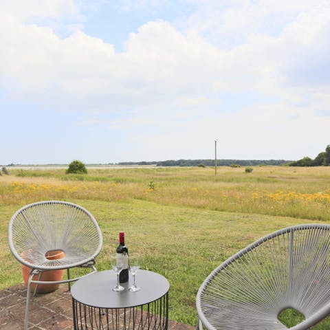 Have a glass of wine outside in the open countryside