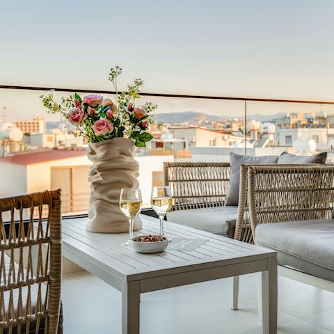 Relax out on the private balcony with gorgeous city views