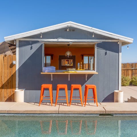 Serve up sundowners at your private poolside bar