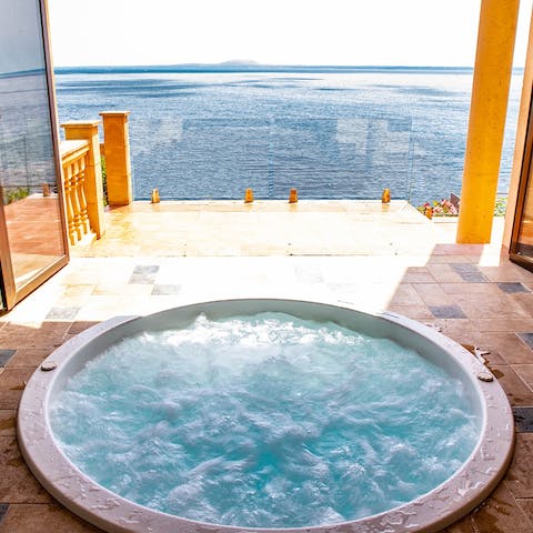 Soak in the Jacuzzi with sweeping sea views