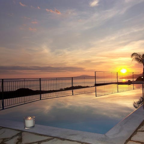 Slip into the hot tub section of the communal pool at sunset