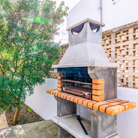 Cook up some Spanish meats and veggies on the traditional brick barbecue
