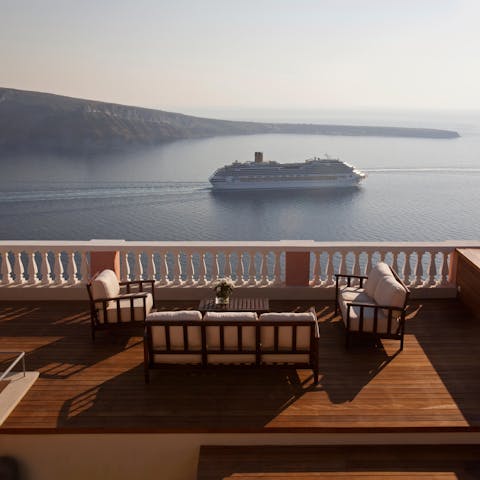 Watch the boats drift by from lavish outdoor lounges