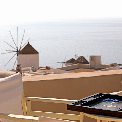 Have a game of backgammon in the sun and admire the ancient windmills nearby