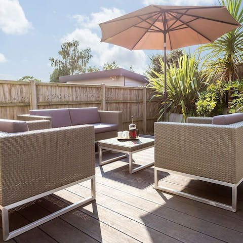 Soak up some sunshine out on the terrace overlooked by palm trees