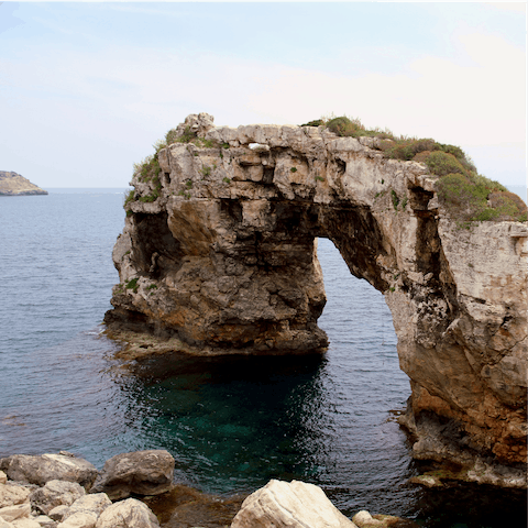 Spend the day lounging on the beautiful S'Amarador beach, just a seventeen-minute drive away