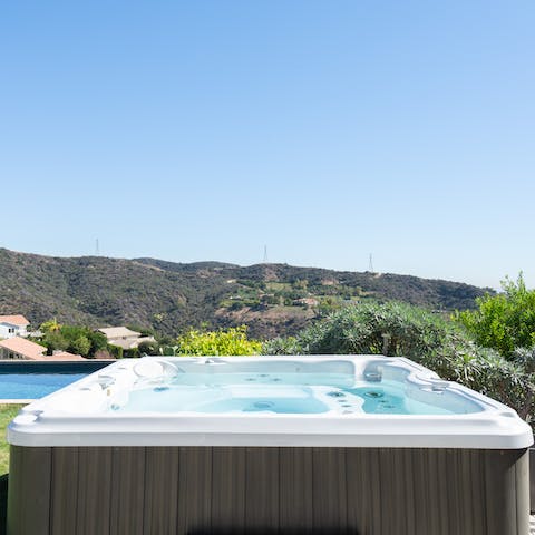 Soak in the hot tub with mountainous views
