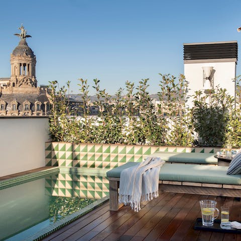 Cool off from the Spanish heat with a dip in the communal rooftop pool