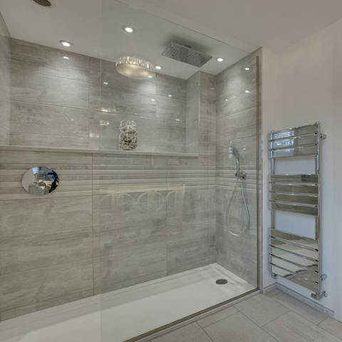 Freshen up in your generous walk-in rain shower