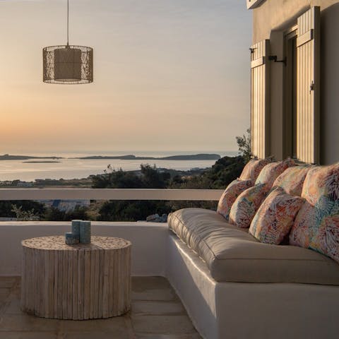 Watch the sun dip in to the Aegean Sea from your balcony, a local glass of wine in hand