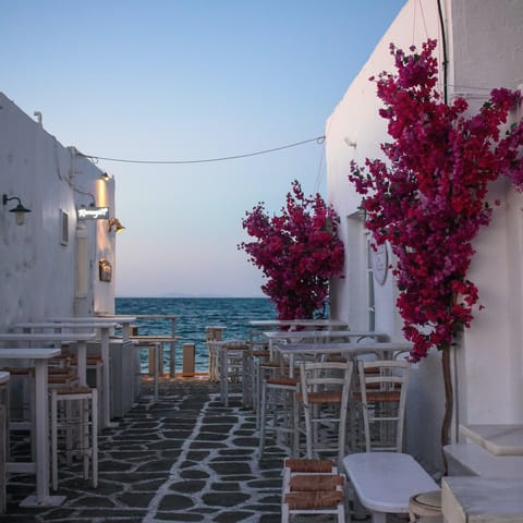 Stroll around cobbled streets of Parikia, an eleven-minute drive from home, before settling into a cosy taverna for the night