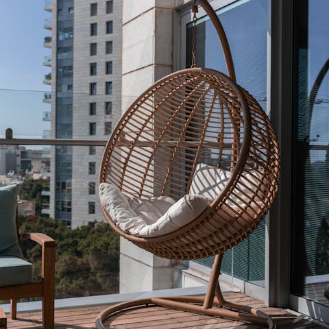 Curl up in the hanging egg chair with a good book