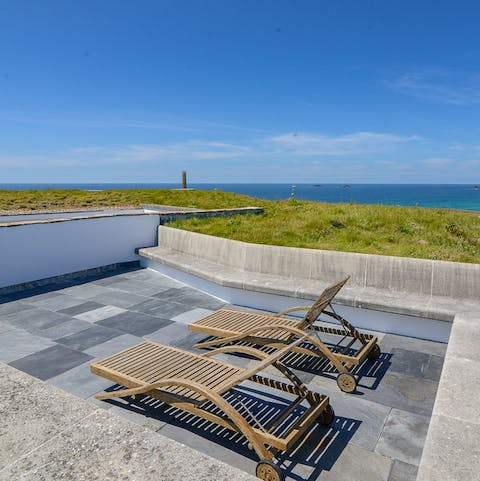 Sunbathe on the roof terrace while gazing out at views of the ocean