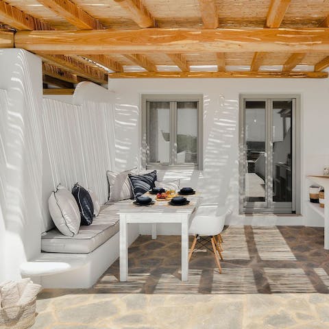 Enjoy the magic of Cycladic living while relaxing on the terrace