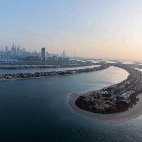 Visit the iconic Palm Jumeirah, a ten-minute trip away by road