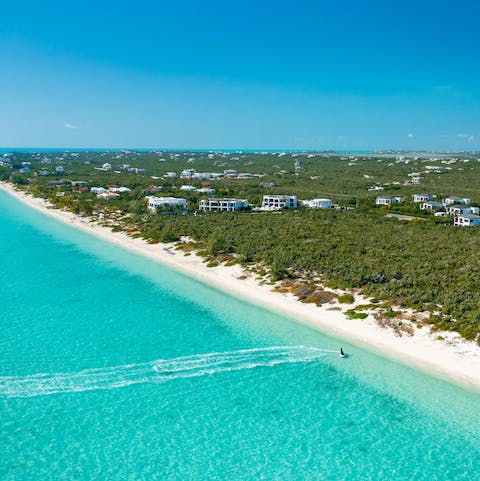 Discover the Turks and Caicos Islands from your location offering private access to Long Bay Beach