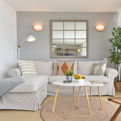 Take a moment to relax in the bright living space after a busy day exploring