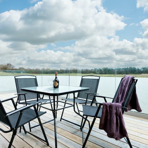 Enjoy evening drinks with loved ones as you soak up the lake views