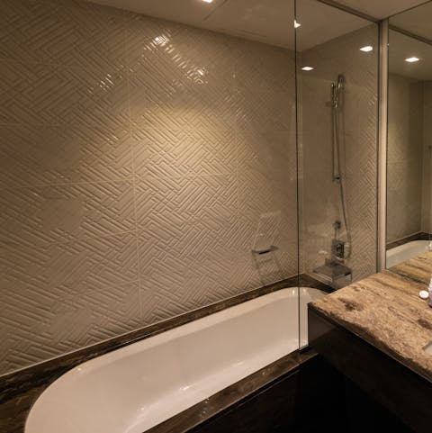 End a productive day of sightseeing with a soak in the chic sunken bathtub