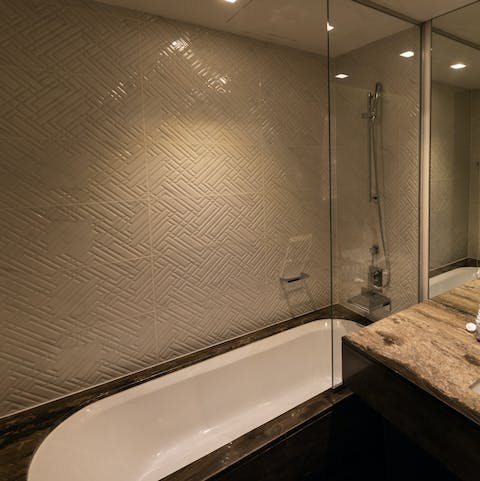 End a productive day of sightseeing with a soak in the chic sunken bathtub