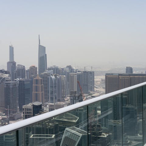 Admire the opulent Dubai skyline from the apartment's balcony