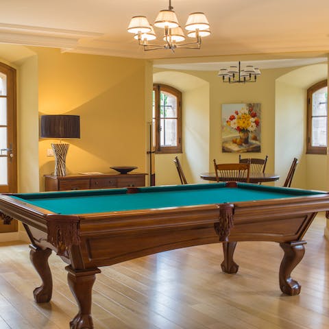 Take on a fellow guest on the handsome wood pool table