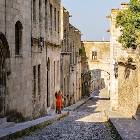 Wander the medieval streets of Rhodes Town, a ten-minute drive away