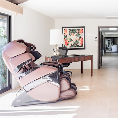 Relax in the high-tech massage chair in the master bedroom
