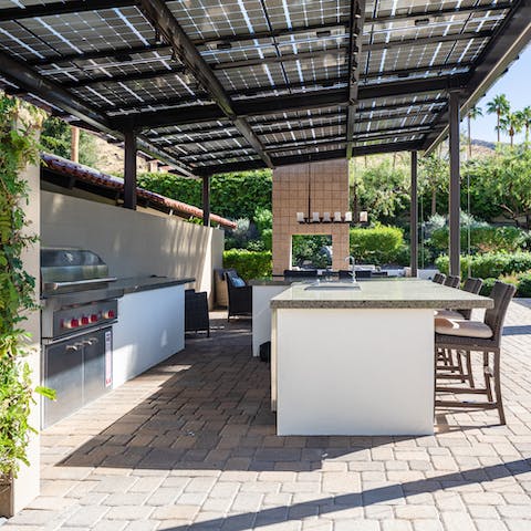 Cook outdoors in the summer kitchen and serve up drinks at the bar
