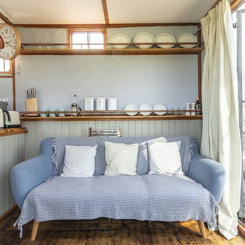 Feel at home in the stylish, cosy space united by skylight blue hues