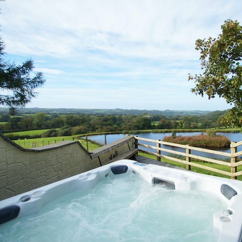 Soak your muscles in the scenic outdoor hot tub