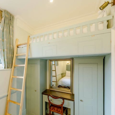 Climb the ladder to the raised bed in the second bedroom – perfect for a child