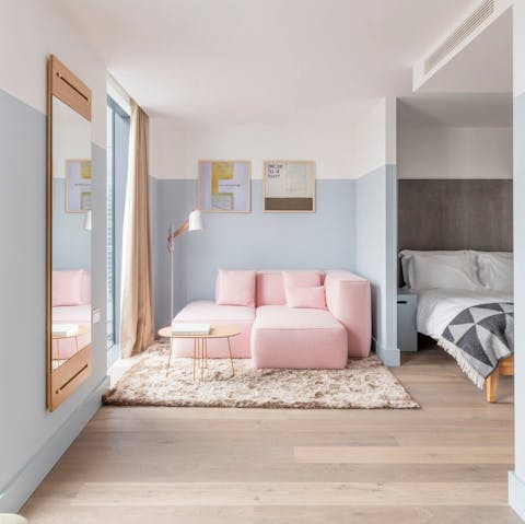 Relax in the calming pastel interiors