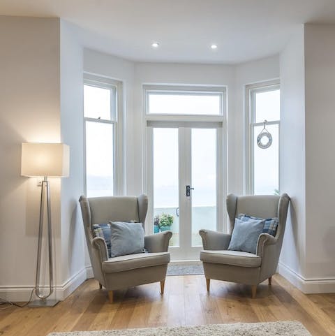 Relax after a busy day at the beach in the sleek living area
