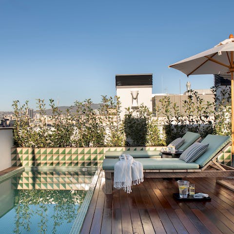 Take a dip in the shared rooftop pool