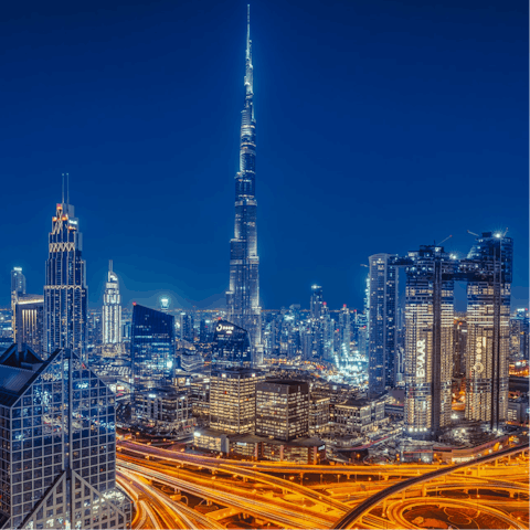Witness the glitz and glam of Dubai at night from your central location
