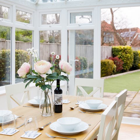 Throw open the glass door and dine in the conservatory