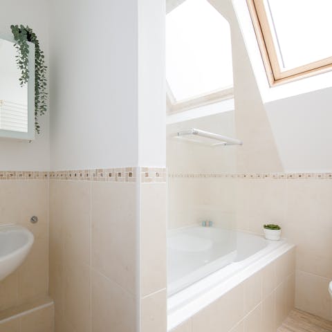 Finish the day with a rejuvenating soak in the bathtub under the skylight