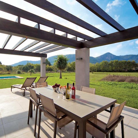 Dine alfresco on the terrace while taking in mountain views
