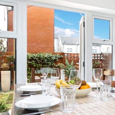 Open the French doors into the garden as you dine