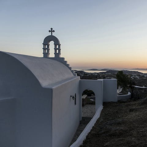 Admire the silhouette of the private chapel at sunset
