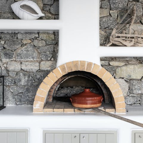 Cook up a rustic feast in the wood-fired oven outside
