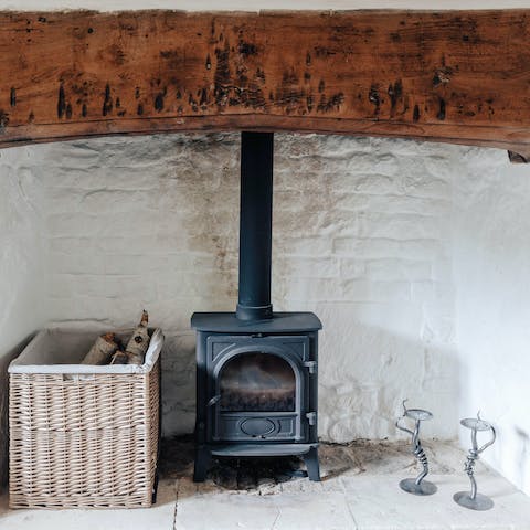 Get cosy around the flickering log fire set in a glorious traditional inglenook fireplace 